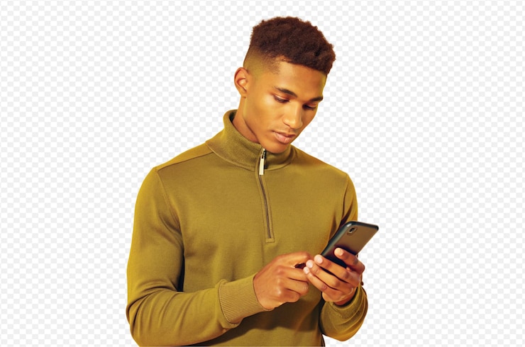 PSD young man short hair dark green quarterzip sweater looking at smartphone casual pose