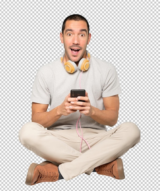 PSD young man in sitting position with a satisfaction gesture