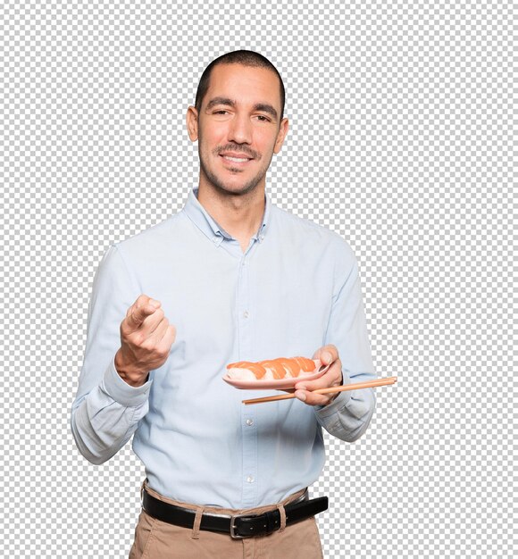 PSD young man using chopsticks to eat sushi