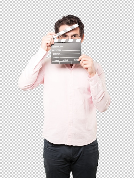 Young man using a clapperboard