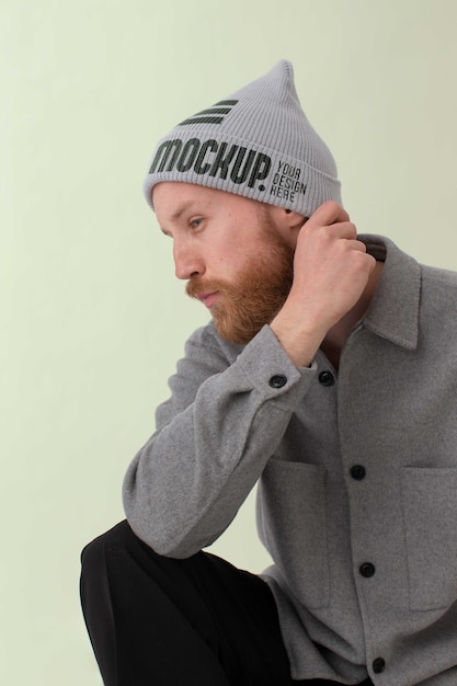 PSD young man wearing beanie mockup