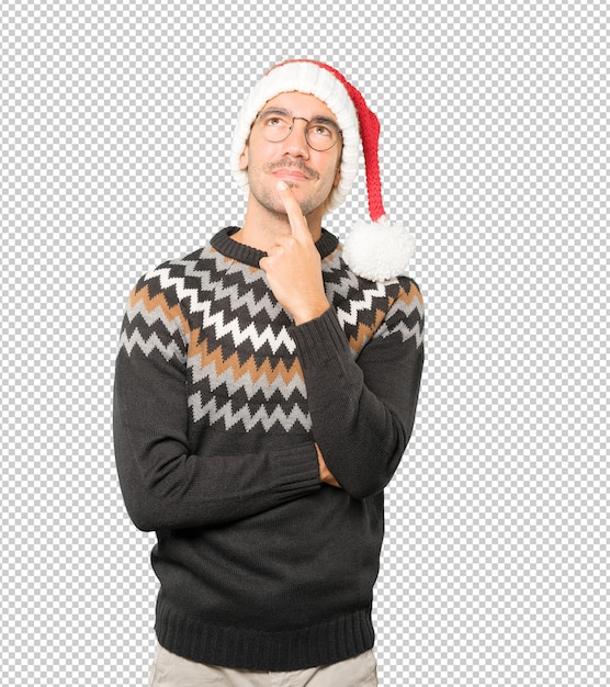 Young man wearing a christmas hat while gesturing isolated