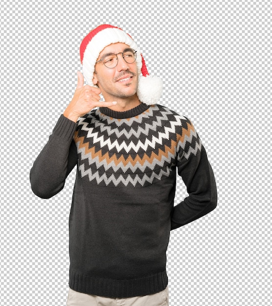 PSD young man wearing a christmas hat while gesturing isolated