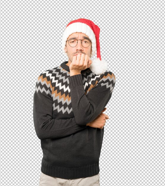 PSD young man wearing a christmas hat while gesturing isolated