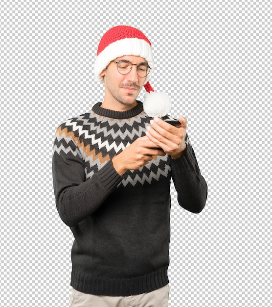 Young man wearing a Christmas hat while gesturing isolated