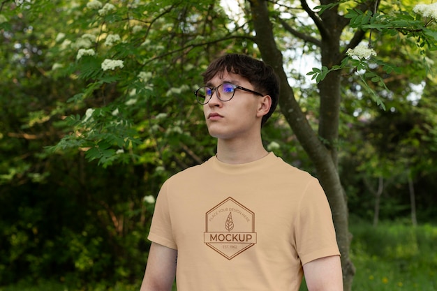 PSD young man wearing a mock-up t-shirt