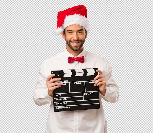 Young man wearing a santa claus hat on christmas day