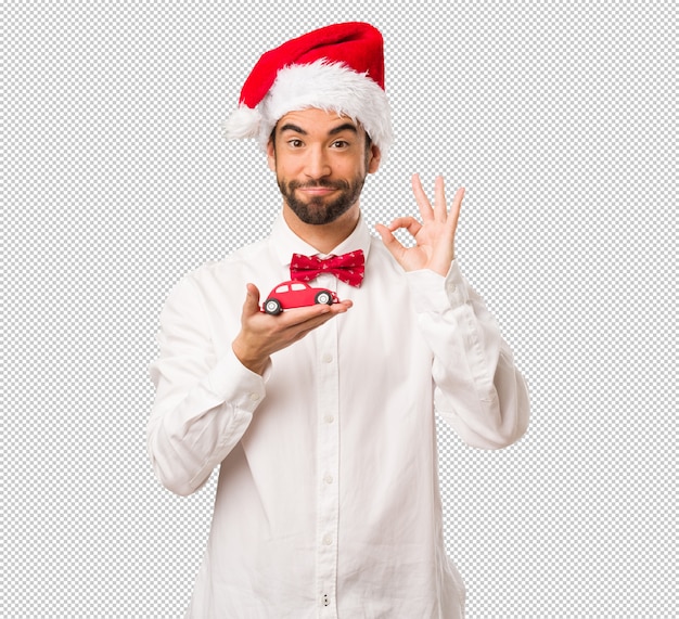 Young man wearing a santa claus hat on Christmas day