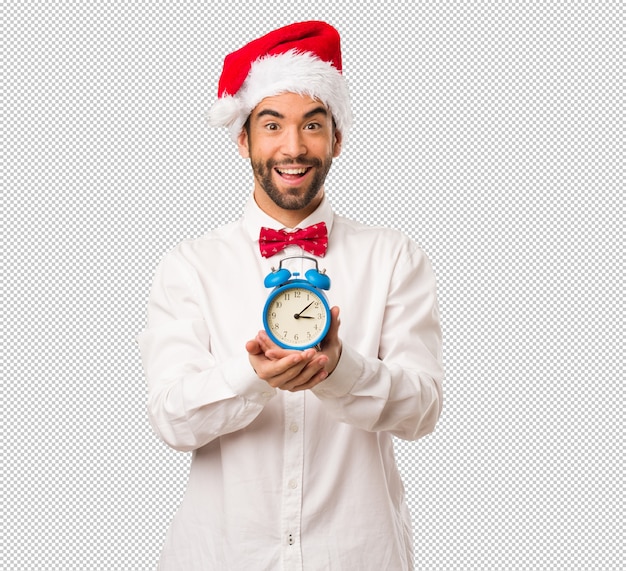 Young man wearing a santa claus hat on christmas day