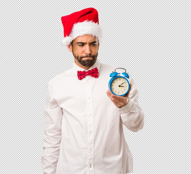 Young man wearing a santa claus hat on Christmas day