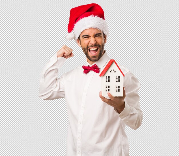 Young man wearing a santa claus hat on christmas day