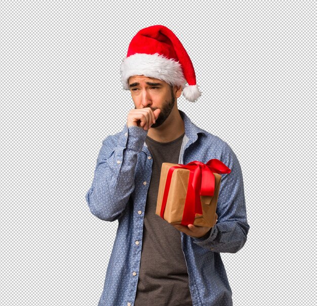 PSD young man wearing santa hat coughing, sick due a virus or infection