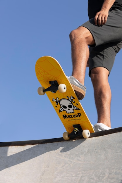 PSD young man with mock-up skateboard