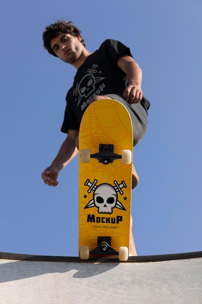 Young man with mock-up skateboard