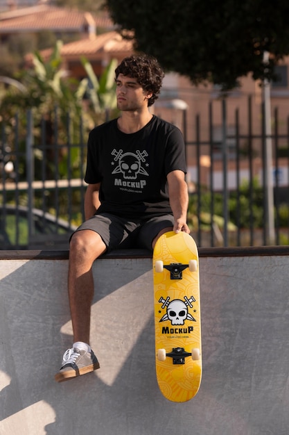 Young man with mock-up skateboard