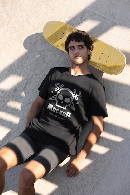 Young man with mock-up skateboard