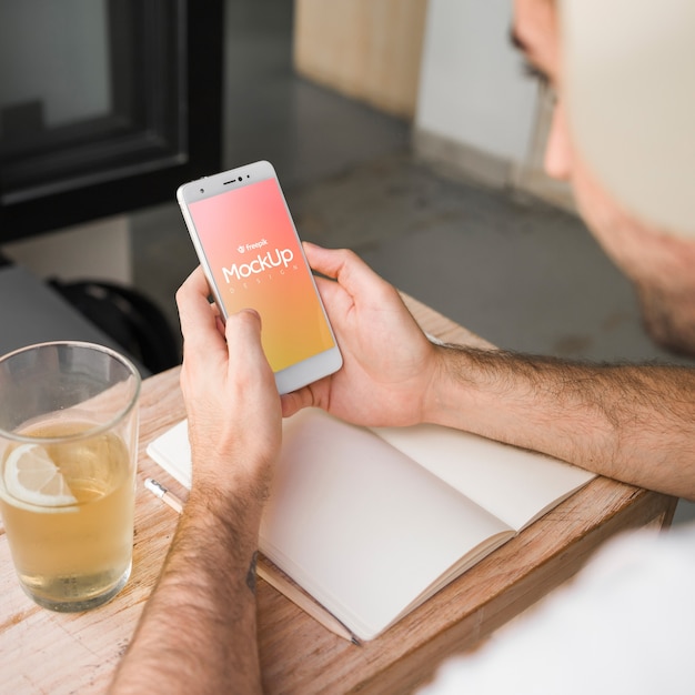 Young man with a smartphone mockup