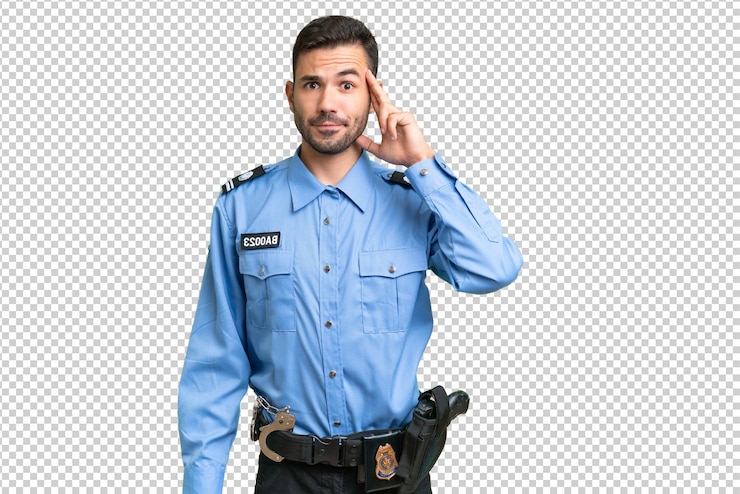 PSD young police caucasian man over isolated background thinking an idea