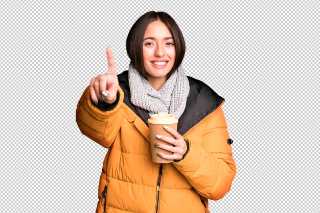 young pretty hispanic woman with a take away coffee and wearing an anorak