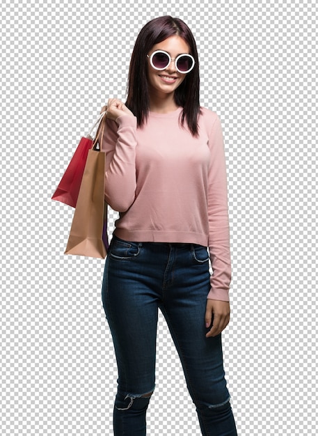 PSD young pretty woman cheerful and smiling, very excited carrying a shopping bags, ready to go shopping and look for new offers