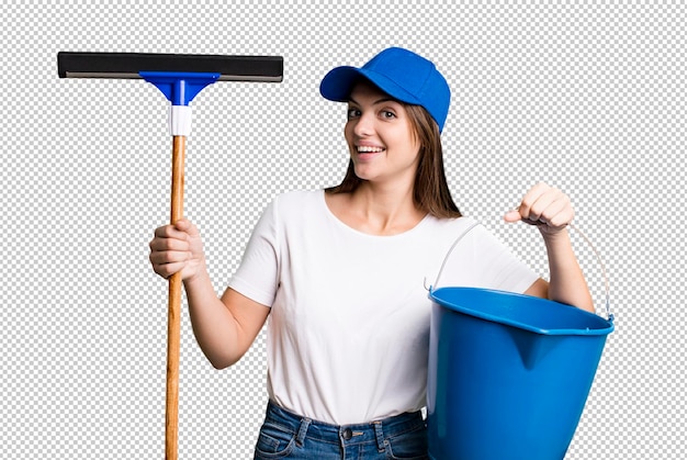 Young pretty woman housekeeper cleaning the windows