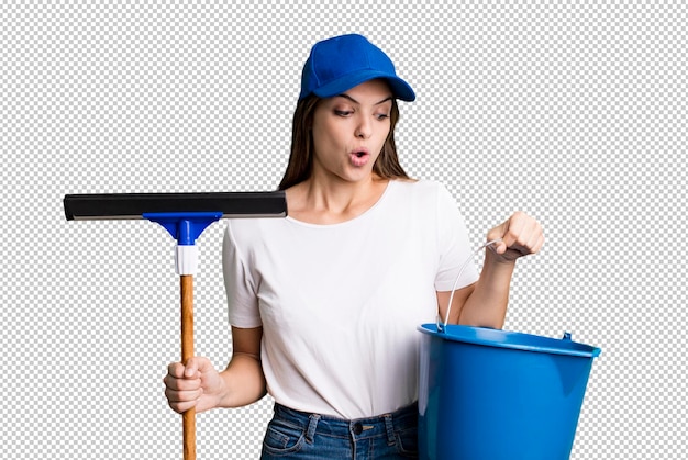 Young pretty woman housekeeper cleaning the windows