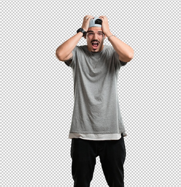 young rapper man frustrated and desperate, angry and sad with hands on head