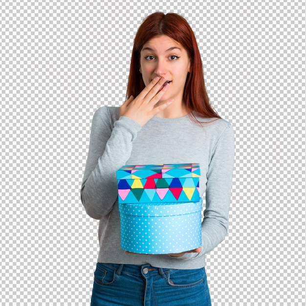 Young redhead girl surprised because has been given a gift