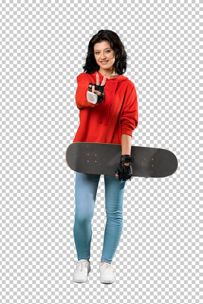 Young skater woman smiling and showing victory sign