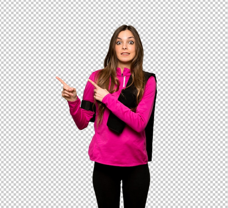 PSD young sport woman frightened and pointing to the side