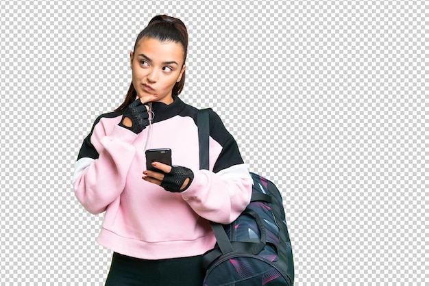 Young sport woman with sport bag over isolated chroma key background thinking and sending a message
