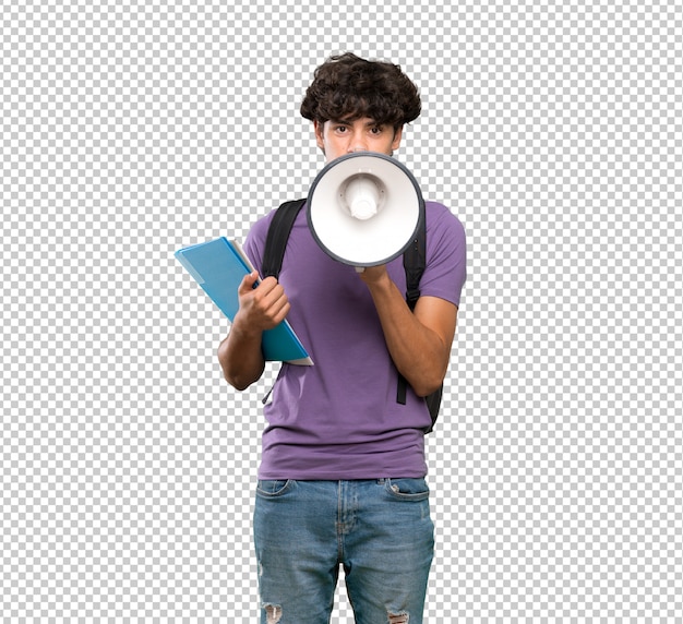 Young student man shouting through a megaphone