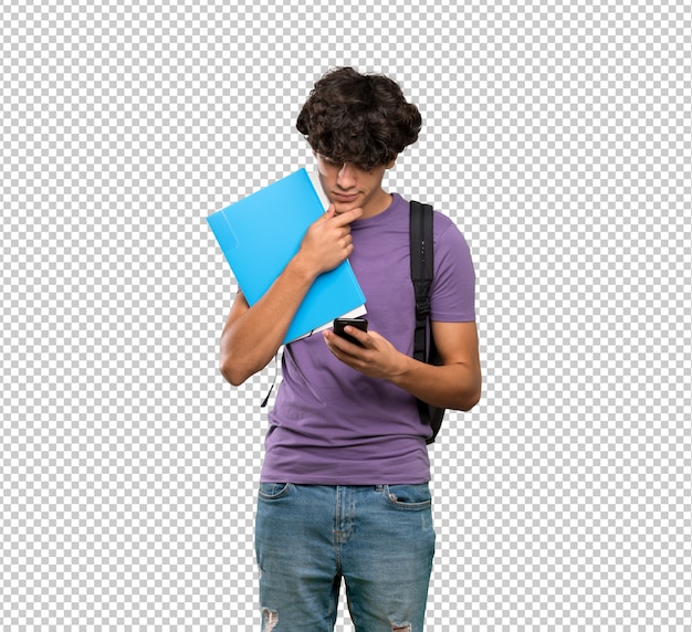 若い学生男思考とメッセージの送信
