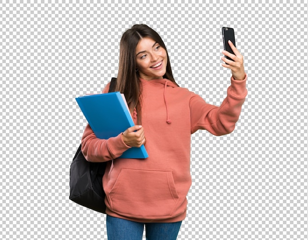 PSD young student woman holding notebooks making a selfie