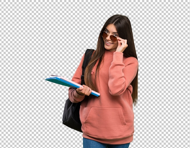 PSD young student woman holding notebooks with glasses and happy