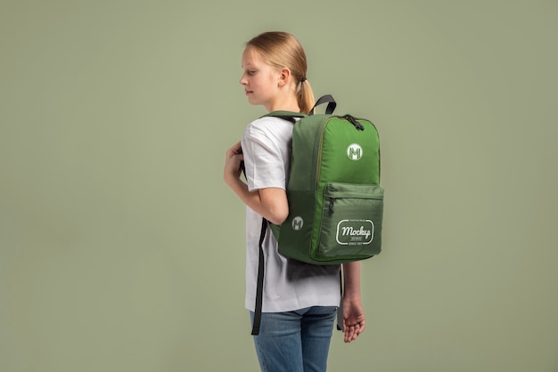 PSD young teenage girl carrying a backpack mock-up