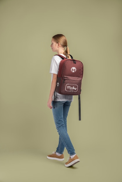 PSD young teenage girl carrying a backpack mock-up