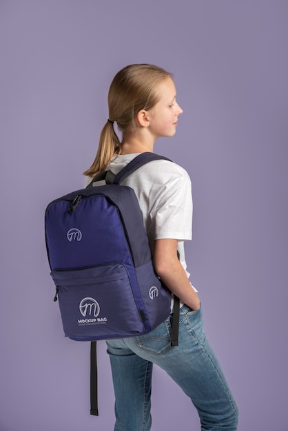 PSD young teenage girl carrying a backpack mock-up