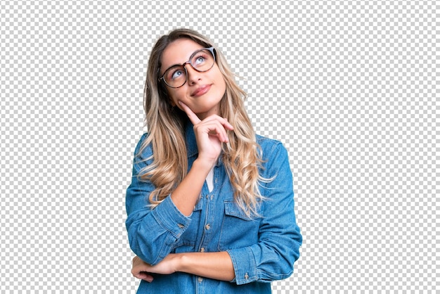 Young uruguayan woman over isolated background having doubts while looking up