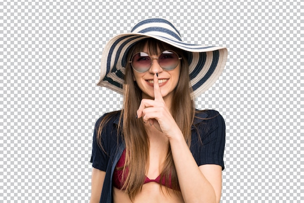 Young woman in bikini doing silence gesture