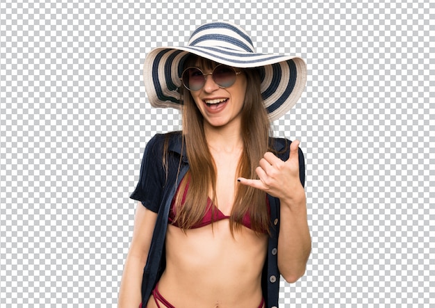 PSD young woman in bikini making phone gesture