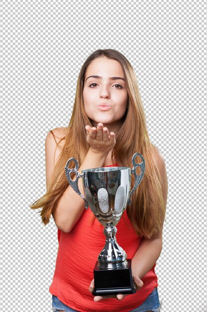 Young woman holding a trophy and sending a kiss