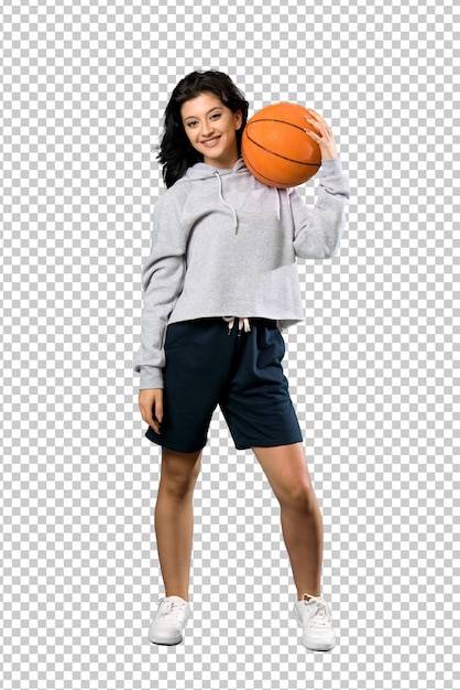 Young woman playing basketball