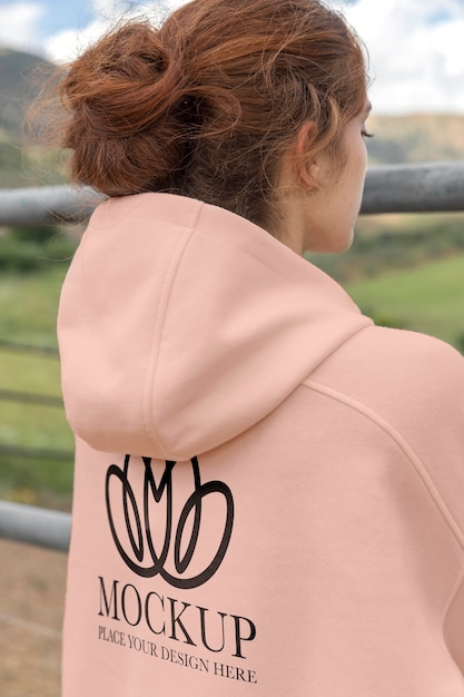 PSD young woman wearing a mock-up hoodie