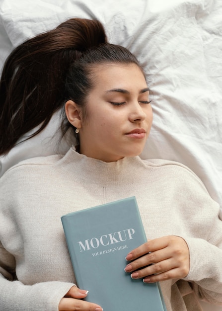 PSD young woman with book mock-up