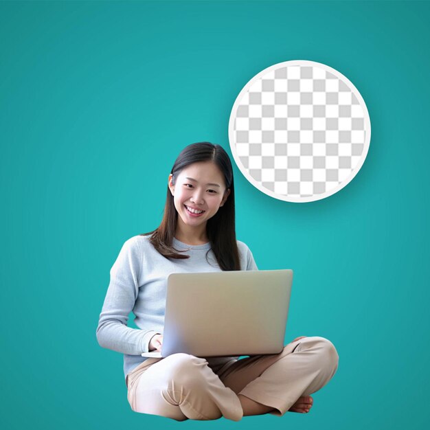 Young woman with a laptop sitting on the floor with phone in victory position