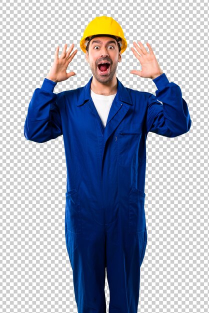 PSD young workman with helmet with surprise and shocked facial expression.