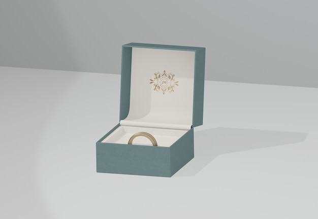 PSD zielone pudełko z biżuterią ze złotą obrączką