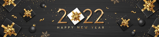 2022 happy new year text with black gift box and golden ribbon concept design