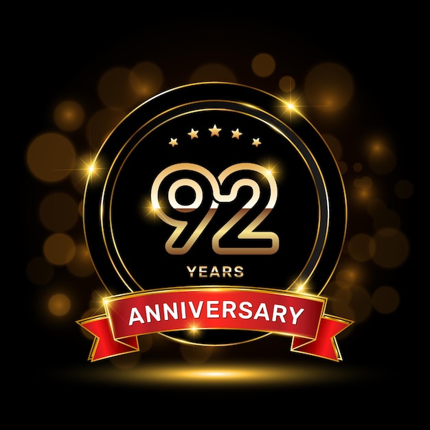 92 year anniversary logo with a gold emblem shape and red ribbon